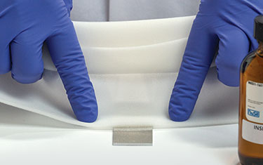 material attached to surface prepared with silicone primer